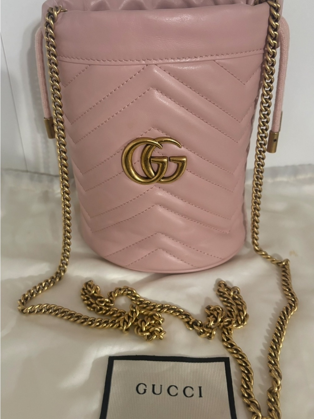Authentic Gucci Soft Pink Chevron leather Mini Bucket Bag with Gold GG Chain.